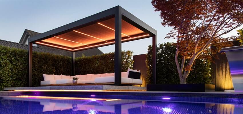 Aluminium pergola shown in the evening with LED lighting