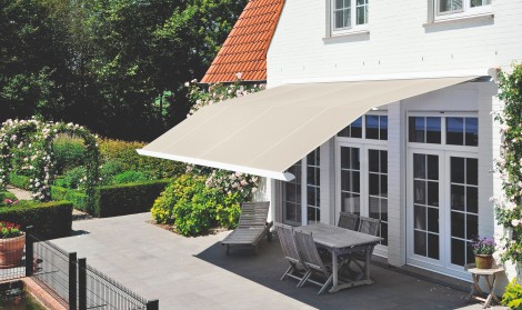 Brustor electric awning installed above a garden patio