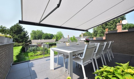 Brustor retractable awning installed over a patio