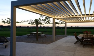 A pergola in early evening with lighting